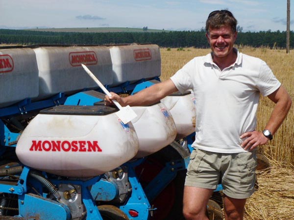 No-Till farmer Steve Stamp next to his planter
